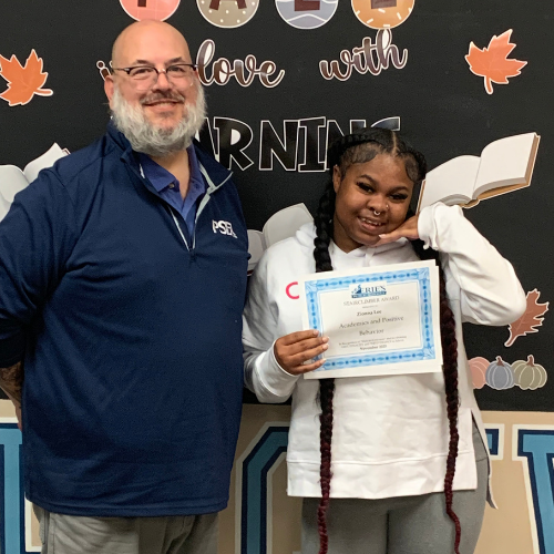 Zionna Lee, DiPaolo SSC's Stairclimber for October, poses with his award plaque.